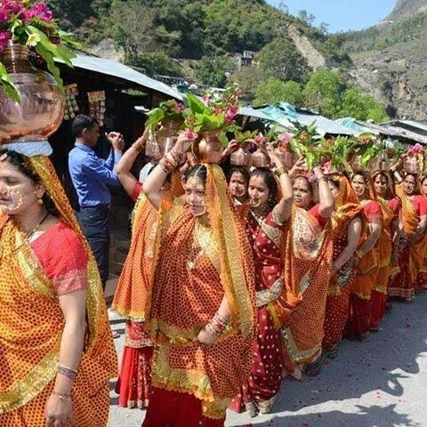Women in traditional Kumaoni attire at a cultural procession